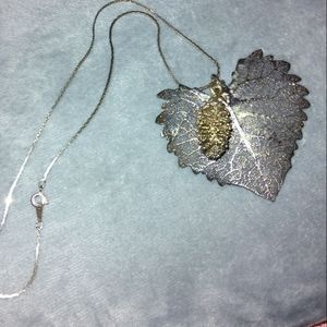 Silvertone leaf with goldtone pinecone necklace